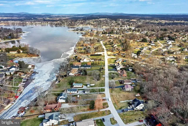 a view of a swimming pool with a yard