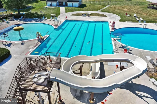 an aerial view of a house with a lake view