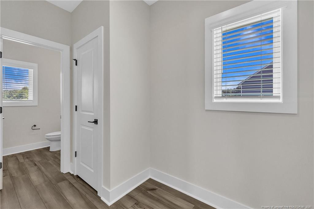 136 Camp Rock Road Lillington, NC 27546 - Photo 20 of 43 a view of hallway with wooden floor