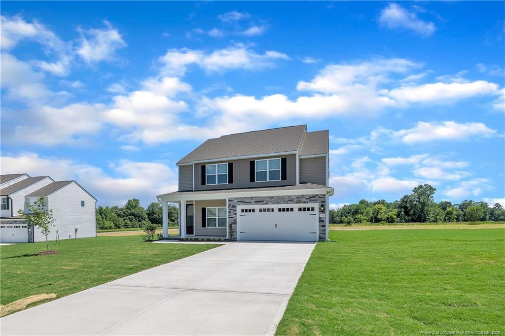 136 Camp Rock Road Lillington, NC 27546 - Photo 2 of 43 a front view of house with yard