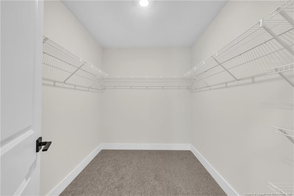 136 Camp Rock Road Lillington, NC 27546 - Photo 30 of 43 a view of a room with racks on the wall