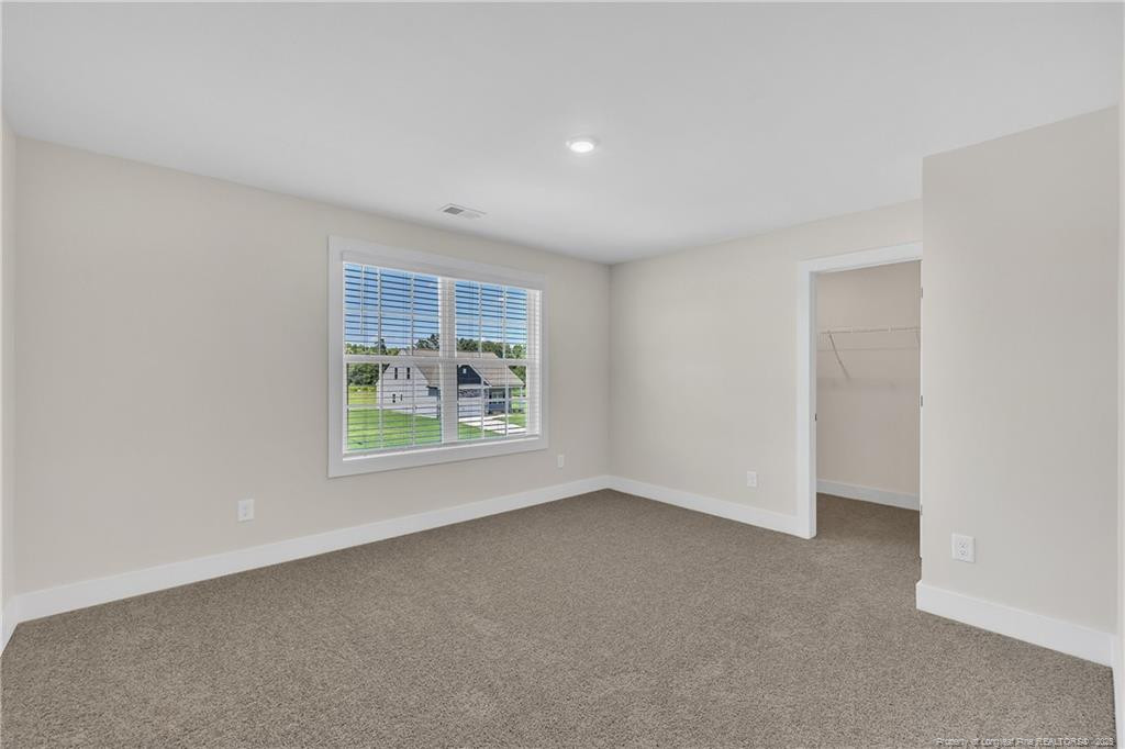 136 Camp Rock Road Lillington, NC 27546 - Photo 31 of 43 an empty room with windows