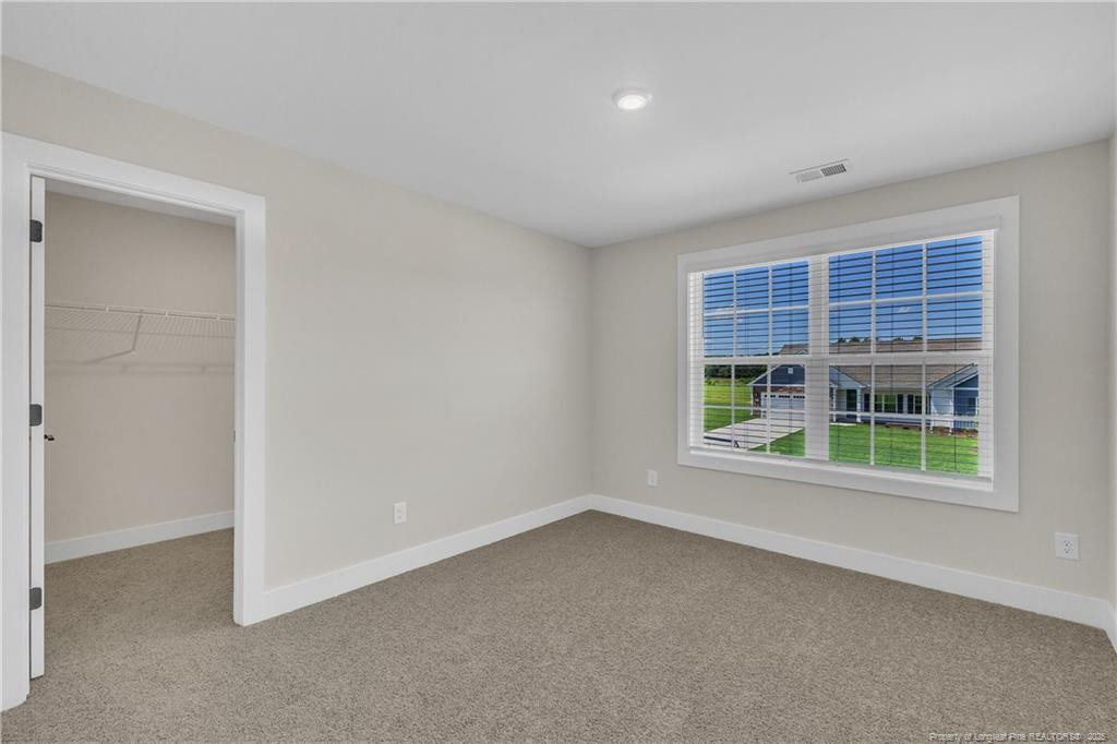 136 Camp Rock Road Lillington, NC 27546 - Photo 33 of 43 an empty room with windows and entrance