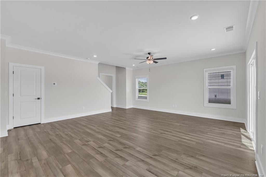 136 Camp Rock Road Lillington, NC 27546 - Photo 10 of 43 wooden floor in an empty room with a window
