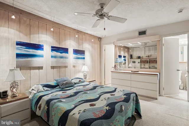 a bed room with a bed and a book shelf