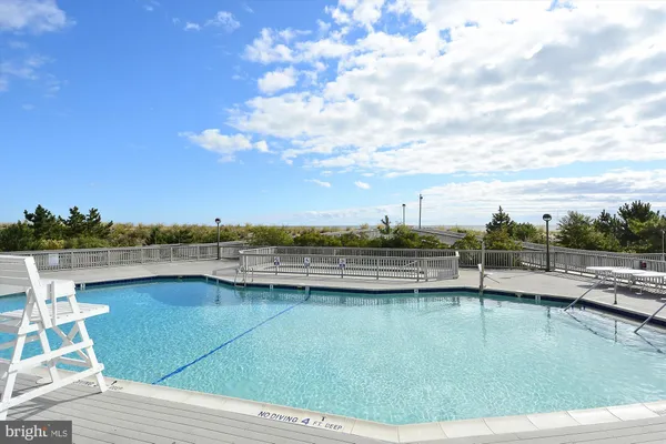 a view of a swimming pool and an ocean