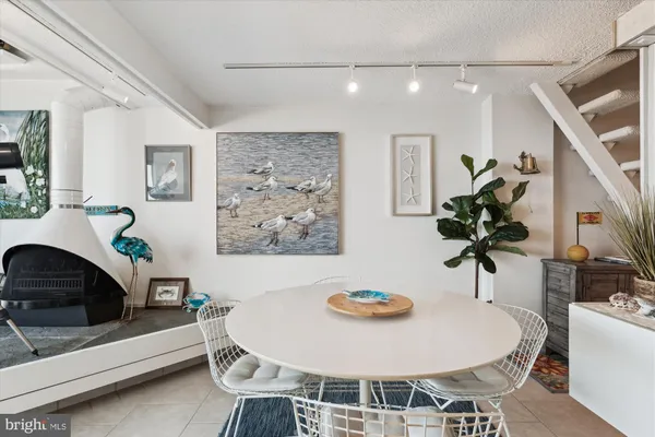a kitchen with a white cabinets and white appliances
