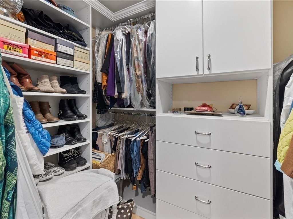 26 Wompatuck Road Hingham, MA 02043 - Photo 11 of 24 a view of walk in closet with clothes and shoes