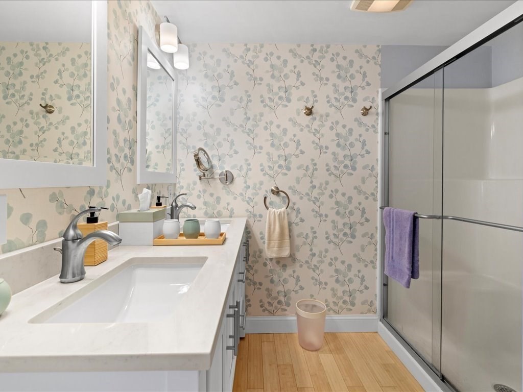 26 Wompatuck Road Hingham, MA 02043 - Photo 12 of 24 a bathroom with a sink a toilet and shower