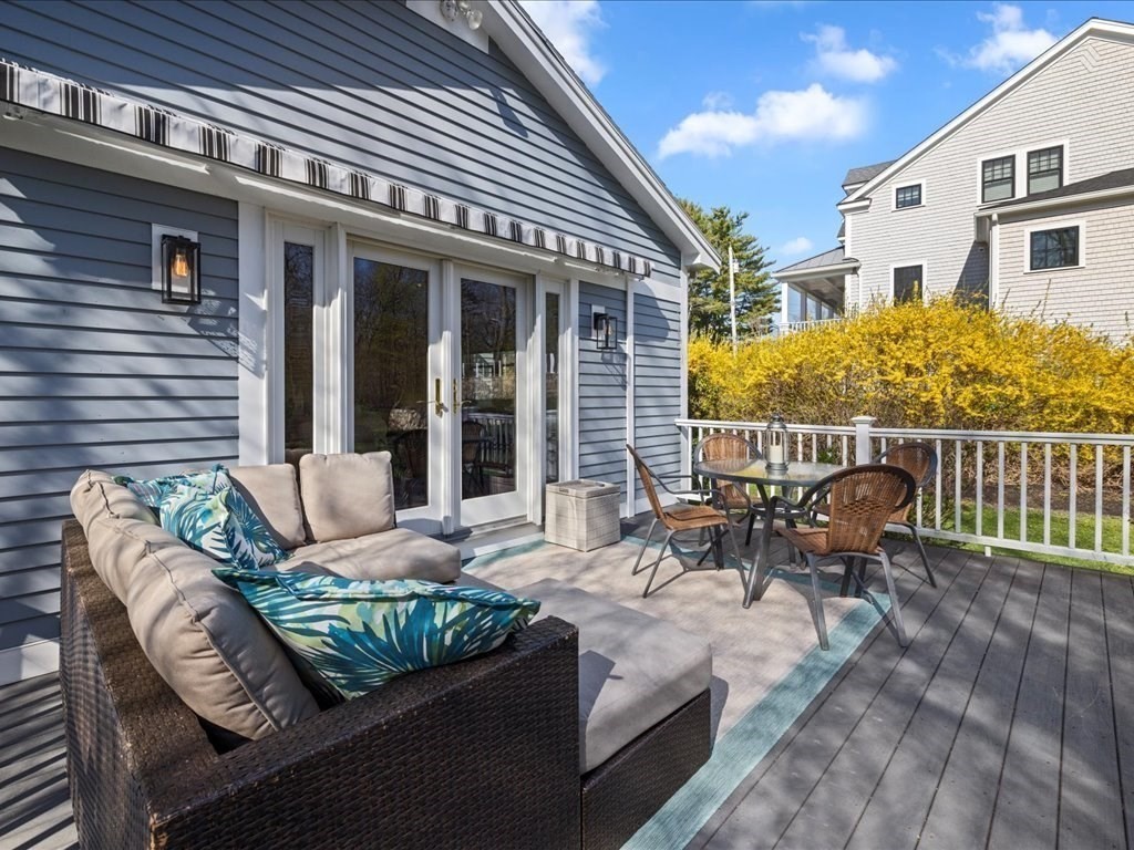 26 Wompatuck Road Hingham, MA 02043 - Photo 21 of 24 a view of a patio with couches chairs and wooden floor