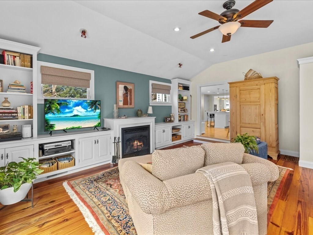 26 Wompatuck Road Hingham, MA 02043 - Photo 3 of 24 a living room with furniture a flat screen tv and a fireplace