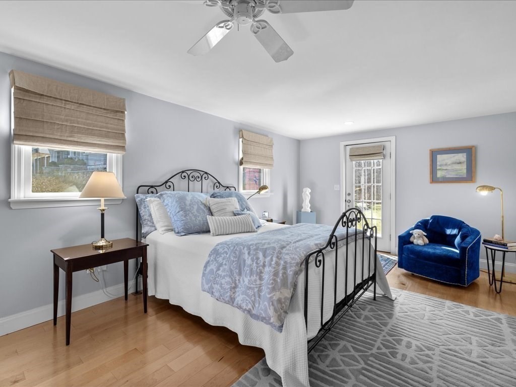 26 Wompatuck Road Hingham, MA 02043 - Photo 10 of 24 a bedroom with a bed a couch and a potted plant