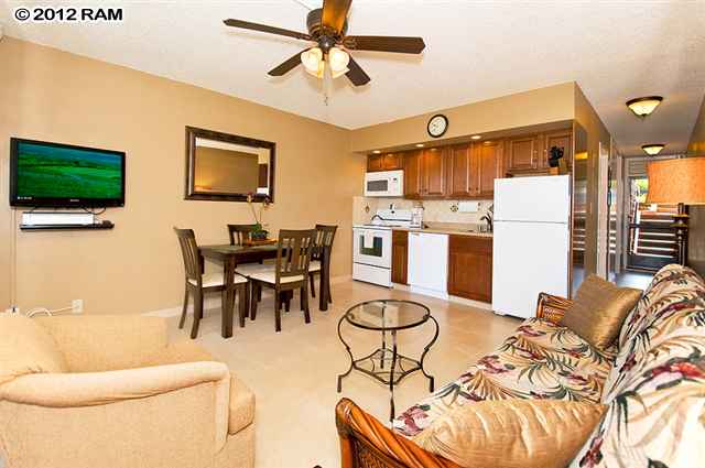 3959 Lower Honoapiilani Road, Unit 305 Lahaina, HI 96761 - Photo 1 of 16 a living room with furniture and a flat screen tv