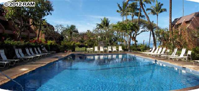 3959 Lower Honoapiilani Road, Unit 305 Lahaina, HI 96761 - Photo 11 of 16 a view of swimming pool with a table and chairs