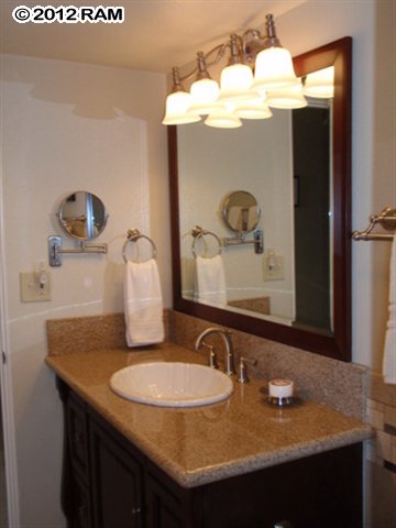 3959 Lower Honoapiilani Road, Unit 305 Lahaina, HI 96761 - Photo 3 of 16 a bathroom with a sink and a mirror