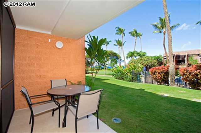 3959 Lower Honoapiilani Road, Unit 305 Lahaina, HI 96761 - Photo 7 of 16 a view of a chairs and table in patio