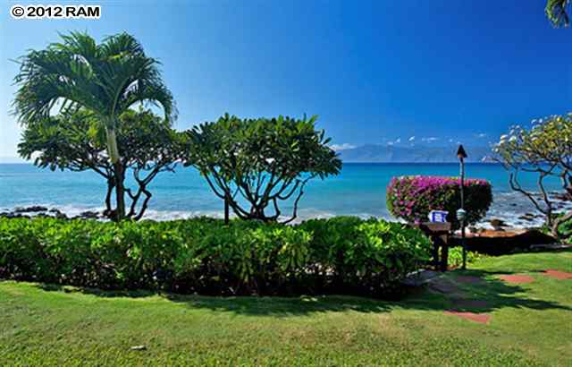 3959 Lower Honoapiilani Road, Unit 305 Lahaina, HI 96761 - Photo 10 of 16 a front view of a house with a yard