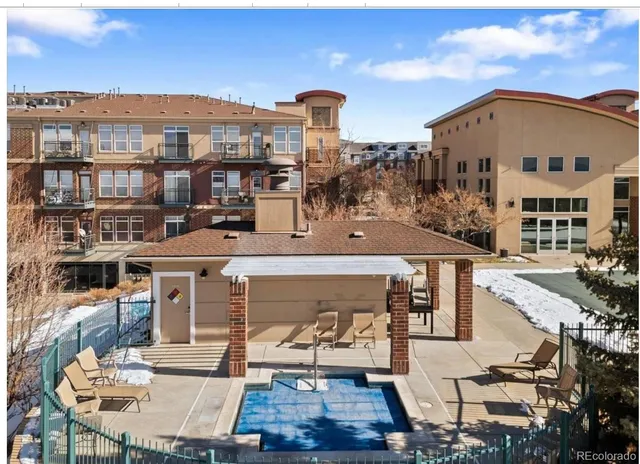 a view of swimming pool with a yard