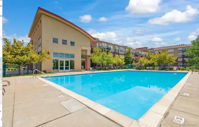 a view of a patio with a table and chairs