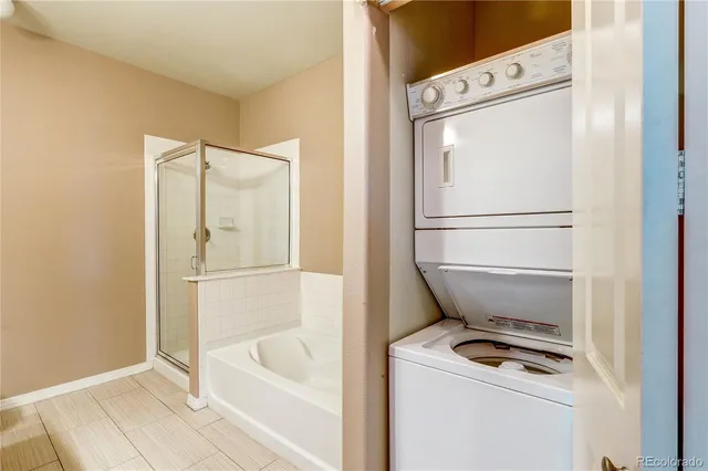 a white bath tub sitting next to a white toilet