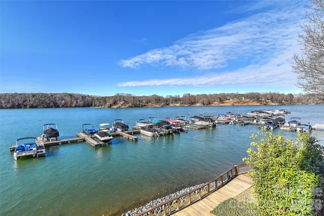 a view of a lake with houses in the back