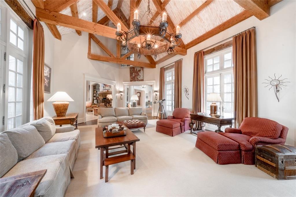 1955 Alec Mountain Road Clarkesville, GA 30523 - Photo 14 of 110 a living room with furniture a chandelier and a large window
