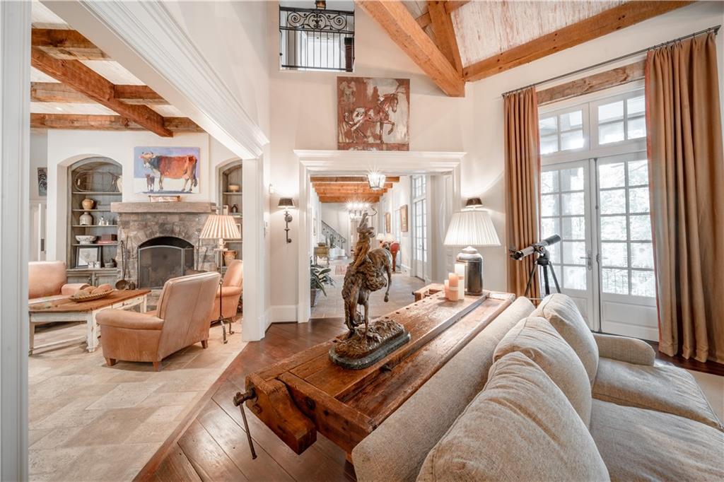 1955 Alec Mountain Road Clarkesville, GA 30523 - Photo 17 of 110 a living room with furniture a fireplace and a large window