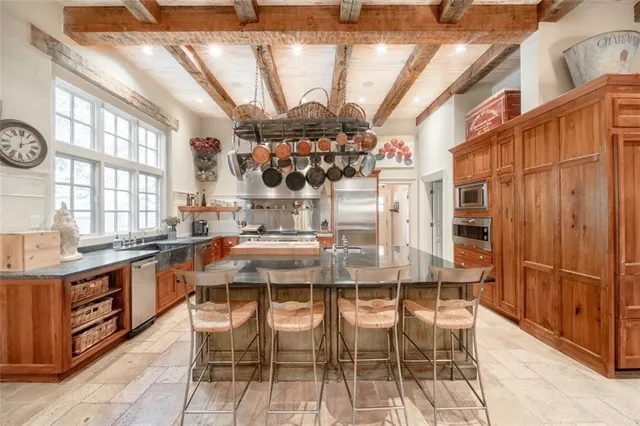 a living room with furniture fireplace and a table