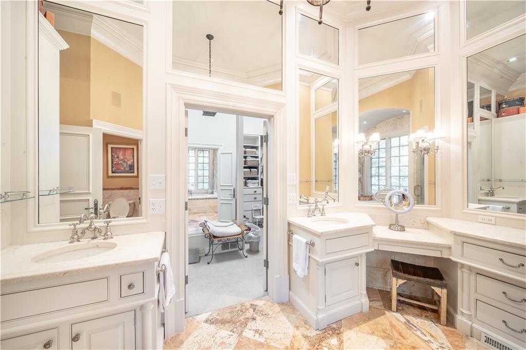 1955 Alec Mountain Road Clarkesville, GA 30523 - Photo 36 of 110 a spacious bathroom with a double vanity sink a mirror and a bathtub