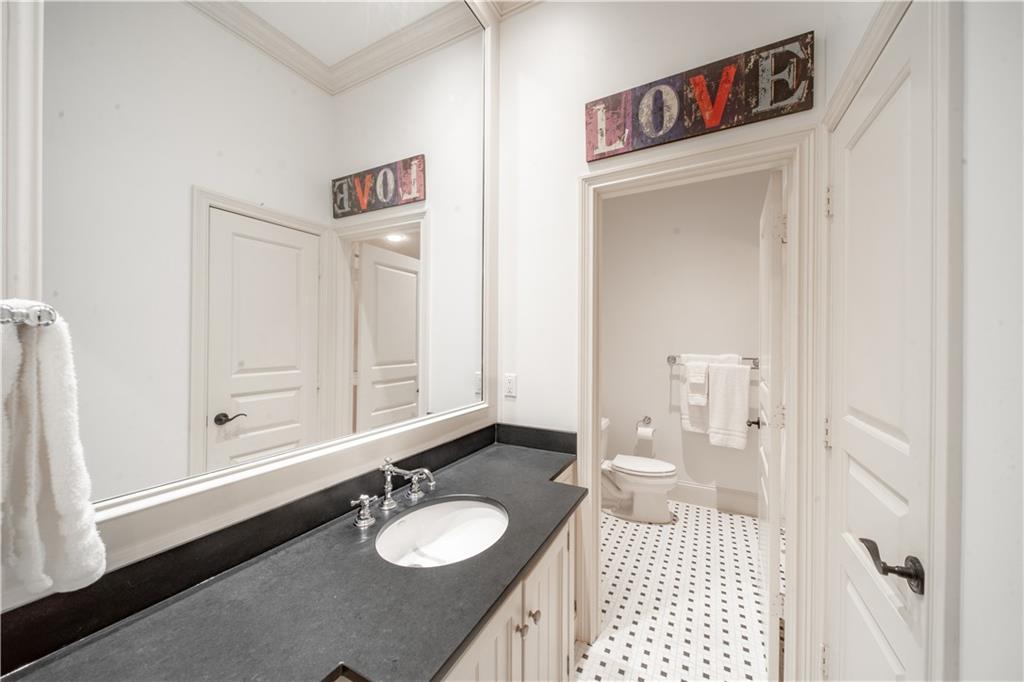 1955 Alec Mountain Road Clarkesville, GA 30523 - Photo 49 of 110 a bathroom with a sink vanity granite and a mirror