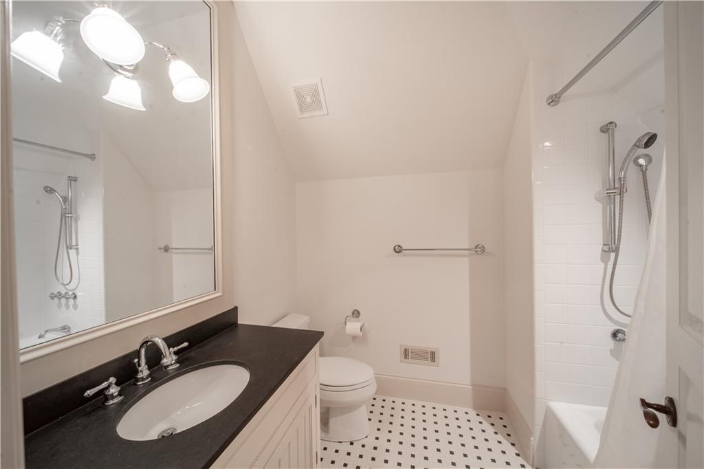 1955 Alec Mountain Road Clarkesville, GA 30523 - Photo 57 of 110 a bathroom with a granite countertop sink toilet a mirror a vanity and shower