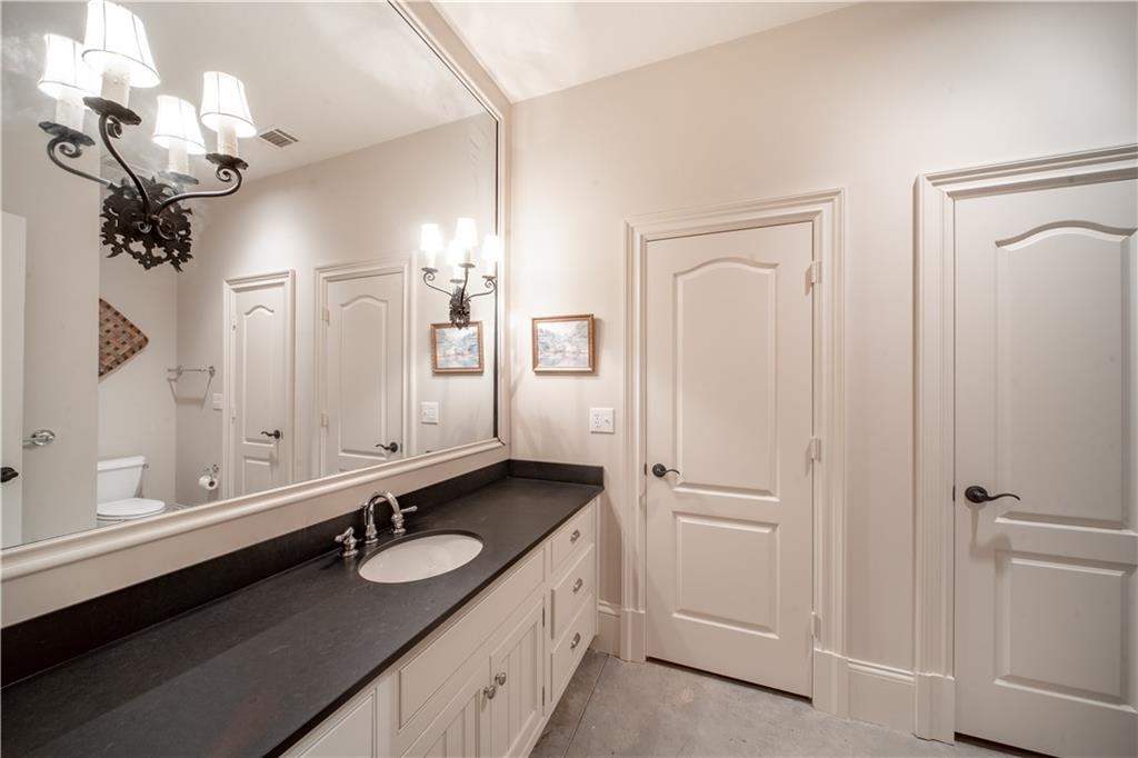 1955 Alec Mountain Road Clarkesville, GA 30523 - Photo 60 of 110 a bathroom with a double vanity sink and a mirror