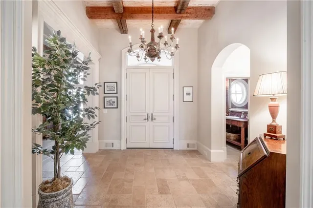 a living room with furniture a fireplace and a large window