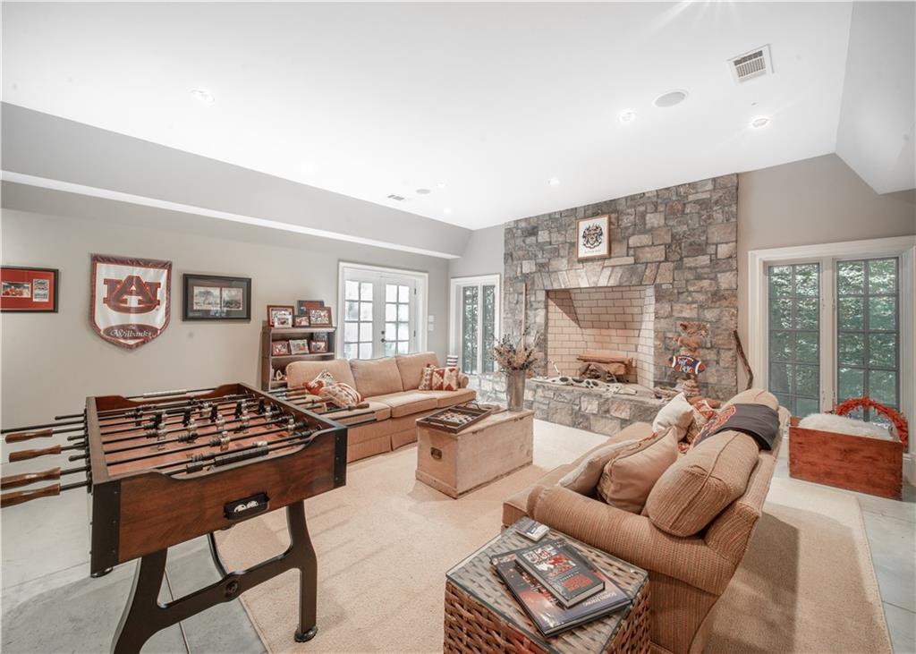 1955 Alec Mountain Road Clarkesville, GA 30523 - Photo 62 of 110 a living room with furniture a wooden floor and a large window