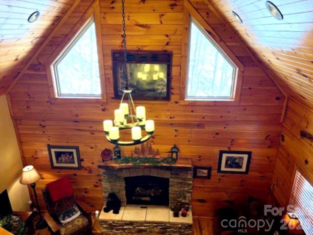 399 Bent Tree Road Maggie Valley, NC 28751 - Photo 17 of 48 a living room with fireplace furniture and a window