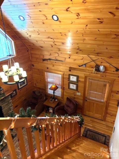 399 Bent Tree Road Maggie Valley, NC 28751 - Photo 18 of 48 a view of a balcony with chair and wooden floor