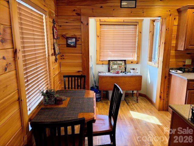 399 Bent Tree Road Maggie Valley, NC 28751 - Photo 23 of 48 a view of a dining room with furniture and a window