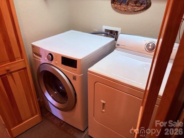 399 Bent Tree Road Maggie Valley, NC 28751 - Photo 29 of 48 a utility room with dryer and washer