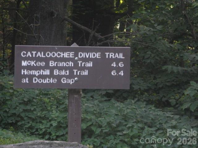 399 Bent Tree Road Maggie Valley, NC 28751 - Photo 47 of 48 a sign that is sitting on a brick wall