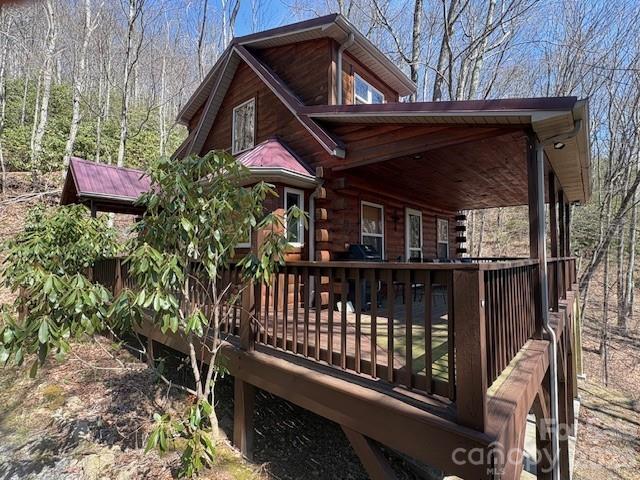 399 Bent Tree Road Maggie Valley, NC 28751 - Photo 5 of 48 a front view of a house with balcony