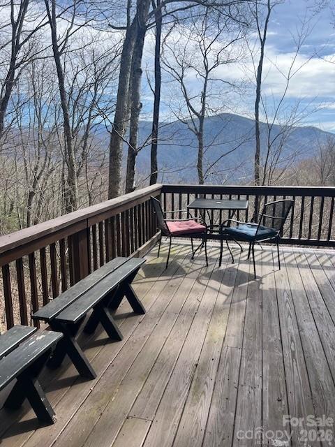 399 Bent Tree Road Maggie Valley, NC 28751 - Photo 9 of 48 a view of balcony with wooden floor and bench