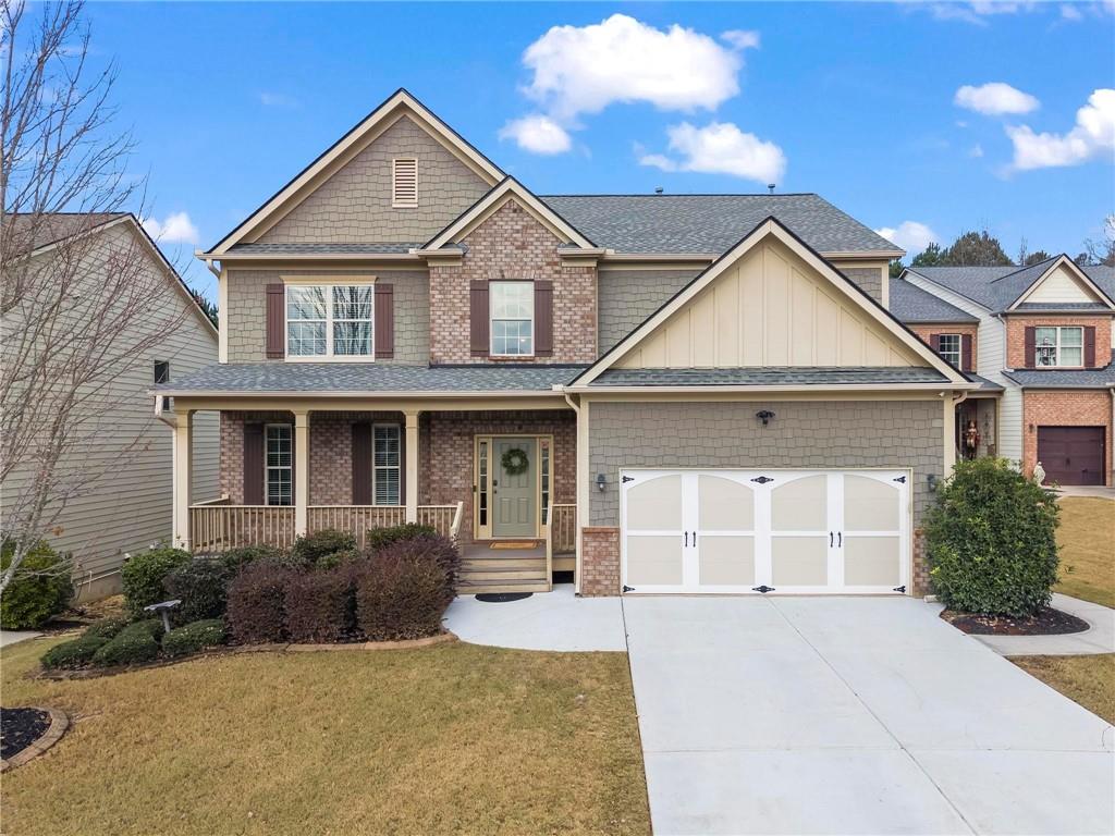 506 Olympic Way Acworth, GA 30102 - Photo 1 of 73 a front view of a house with a yard