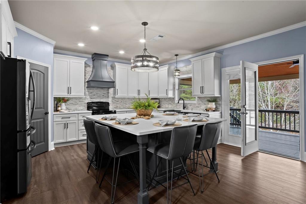 506 Olympic Way Acworth, GA 30102 - Photo 11 of 73 a kitchen with a table and chairs in it