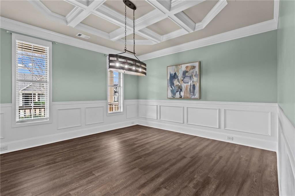 506 Olympic Way Acworth, GA 30102 - Photo 21 of 73 wooden floor in an empty room with a window