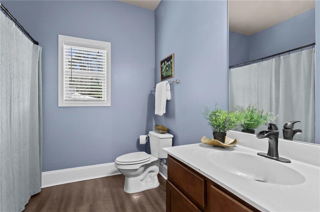 506 Olympic Way Acworth, GA 30102 - Photo 26 of 73 a bathroom with a sink toilet and a mirror