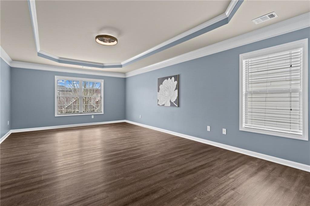 506 Olympic Way Acworth, GA 30102 - Photo 28 of 73 an empty room with wooden floor and windows