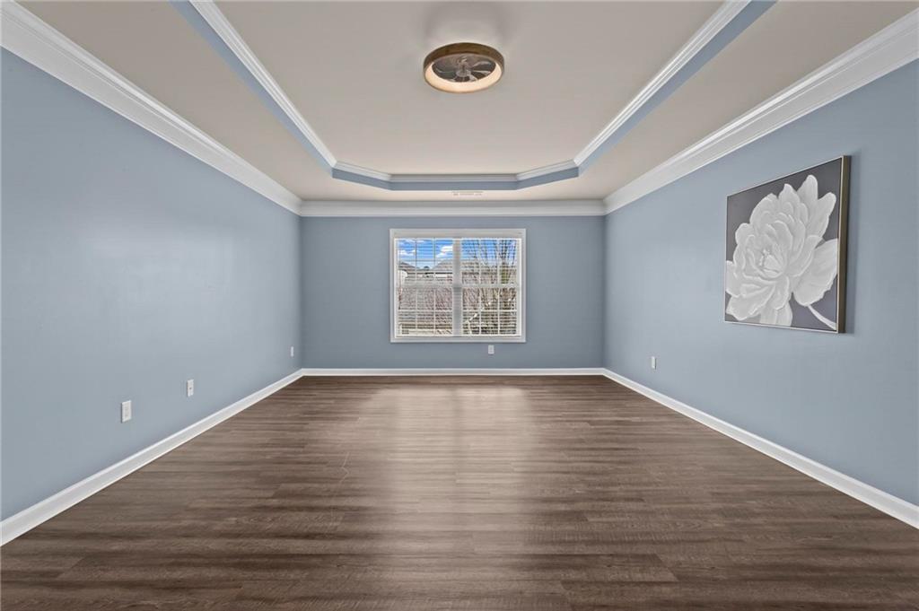 506 Olympic Way Acworth, GA 30102 - Photo 29 of 73 a view of an empty room with wooden floor and window