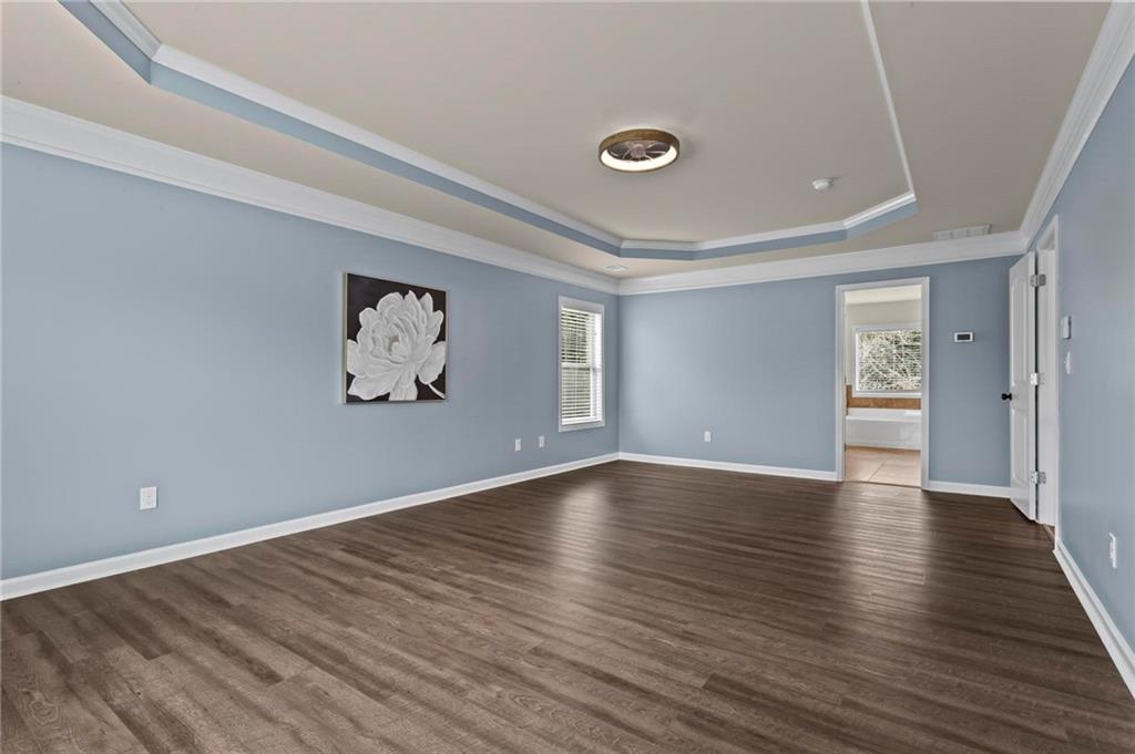 506 Olympic Way Acworth, GA 30102 - Photo 30 of 73 a view of an empty room with wooden floor and a window