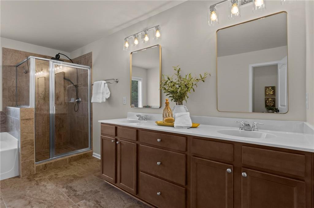 506 Olympic Way Acworth, GA 30102 - Photo 32 of 73 a bathroom with a granite countertop sink and a mirror