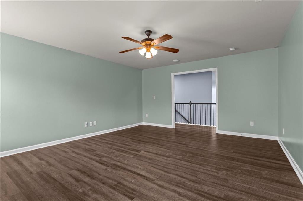506 Olympic Way Acworth, GA 30102 - Photo 38 of 73 a view of an empty room with window and wooden floor